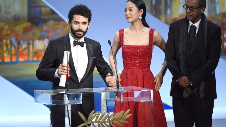 Ely Dagher, Zhou Yun et Abderrahmane Sissako - Palme d'or du court métrage - Waves' 98 © AFP / Anne-Christine Poujoulat