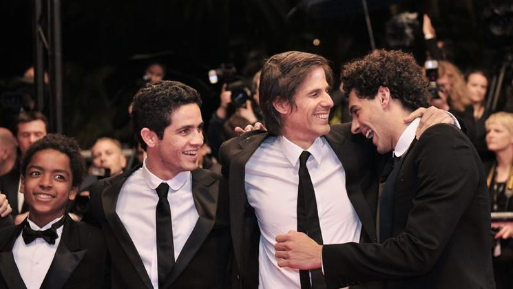 Walter Salles, Joao Baldasserini, Kaique de Jesus Santos and Vinicius de Oliveira Climbing Steps of the film Linha de Passe © AFP