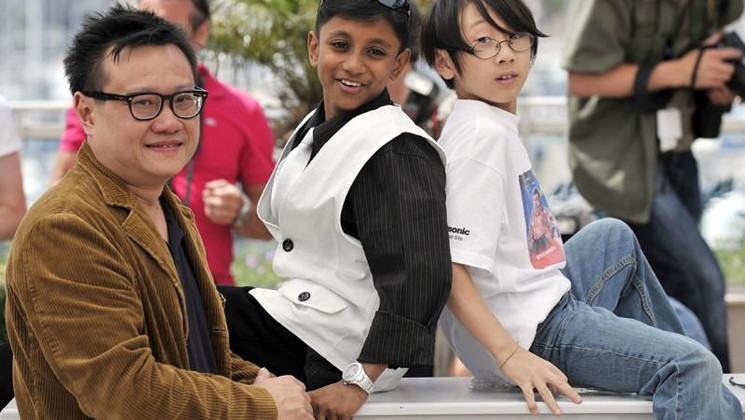 Eric Khoo with Jathisweran and his son, Photocall of the film My Magic © AFP