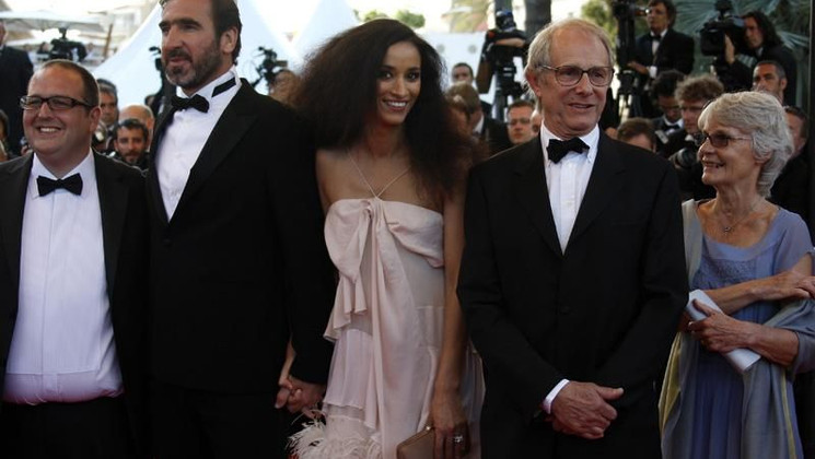 The crew of "Looking for Eric walking up the stairs © AFP © AFP