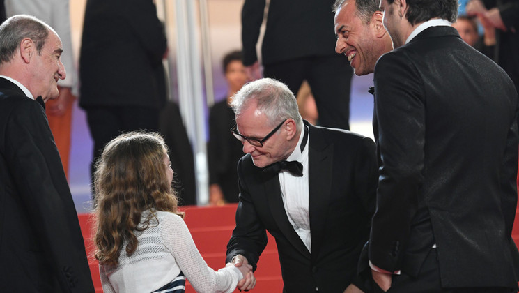 Team of the film Dogman with Thierry Frémaux and Pierre Lescure © Loic Venance/AFP