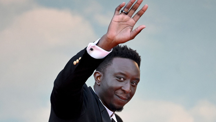 Ahmed Sylla - Montée des marches Un Petit Frère © Loïc Venance / AFP