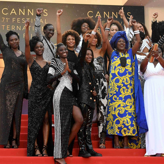 (From top L) French actress Eye Haidara, French actress Maimouna Gueye, French director Magaajyia Silberfeld, French actress and producer France Zobda and French actress Sabine Pakora, (C fromL) French actress and writer Mata Gabin, French writer Rachel Khan, French actress and Miss France 2000 Sonia Rolland, French actress Aissa Maiga, French-Portuguese actress Sara Martins, French actress Firmine Richard and French actress Nadege Beausson-Diagne, (front from L) French actress Assa Sylla, French actress Karidja Toure, French comedian and humorist Shirley Souagnon and French-Cameroonian Marie-Philomene Nga, the 16 black women who fight for equality and inclusion of black women in the French film industry pose on May 16, 2018 with Burundian singer and member of the Feature Film Jury Khadja Nin (C) as they arrive for the screening of the film "Burning" at the 71st edition of the Cannes Film Festival in Cannes, southern France. (Photo by LOIC VENANCE / AFP) © Collectif "Noire n'est pas mon métier"