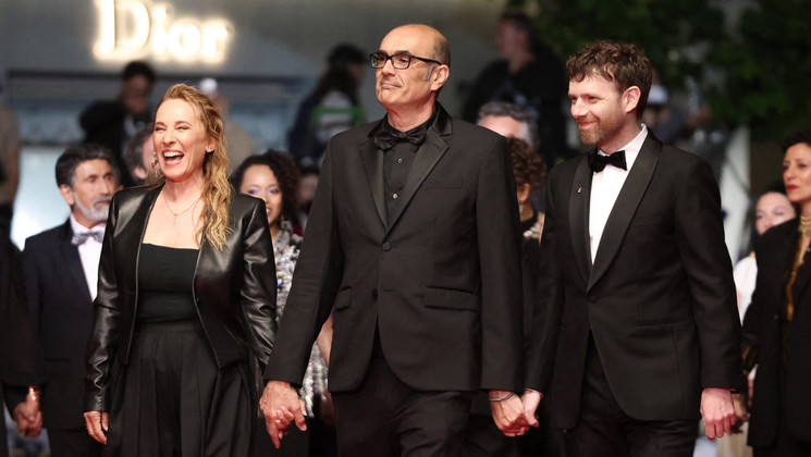 (From L) French actress Emmanuelle Bercot, French director and screenwriter Vincent Garenq and French actor Antoine Reinartz arrive for the screening of the film "L'Abandon" at the 79th edition of the Cannes Film Festival in Cannes, southern France on May 13, 2026. (Photo by Thibaud MORITZ / AFP)